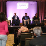 An attendee waits to ask a question to a panel at GridTECH Connect Forum - Southeast